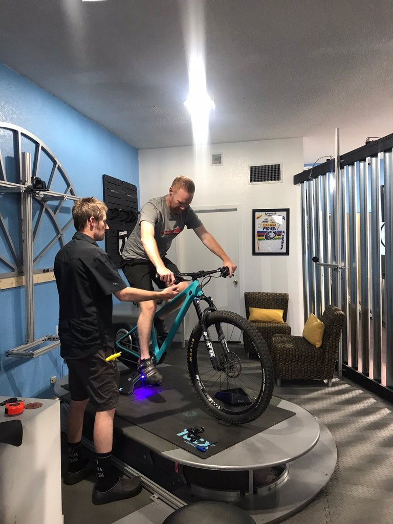 aaron working with a mountain biker on their fit